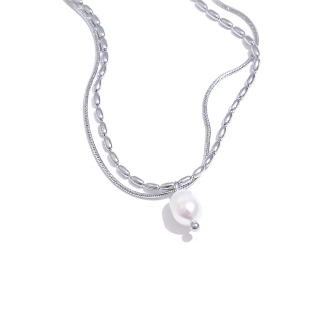 A silver double-layered stainless steel necklace featuring a natural pearl pendant, designed for timeless elegance with a tarnish-resistant finish. Perfect for everyday sophistication. 